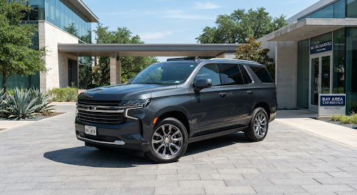 Dark grey seven-seat SUV in daylight